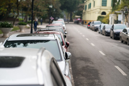 Cars parked on the urban street side
