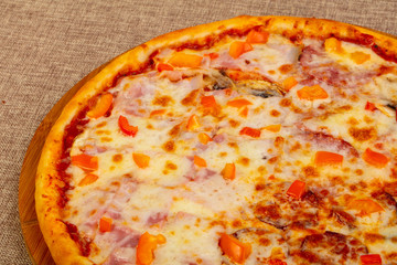 Pizza with ham and sausages