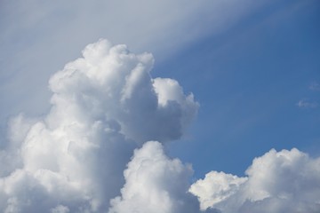 Amazing cumulus clouds and sunlight on the background of clear blue sky, Summer in GA USA.