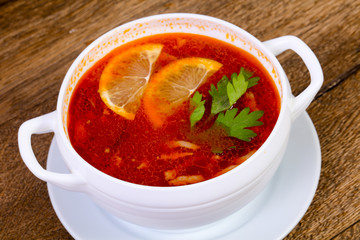 Solyanka soup with lemon