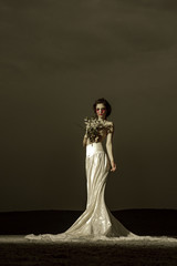 bloody bride. woman with blood tears in wedding dress. bloody bride on halloween. scary and horror...