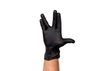 A man's hand in a black rubber glove. Isolate on white background. Concept Gesture Spoсk from the series The Big Bang Theory