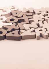 Colorful letter blocks scattered randomly on white