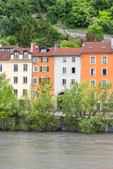 Fototapeta na wymiar Grenoble, beautiful typical houses on the river Isere, in the old town 