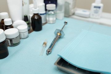 dental syringe for anesthesia lies on the table with other drugs