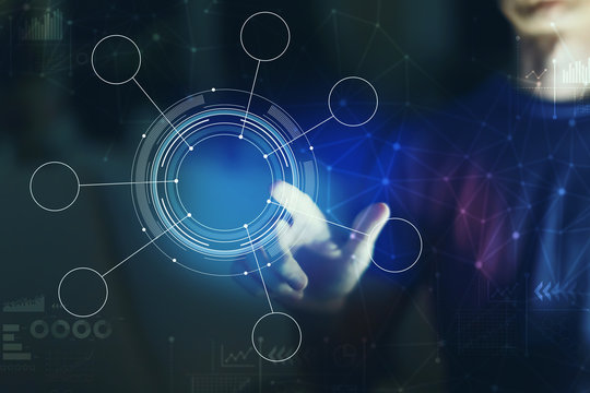 Tech circle with young man pointing on a dark background