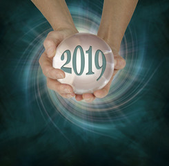 Take a look at what 2019 holds with a Crystal Ball Reading - female hands holding a large scrying...