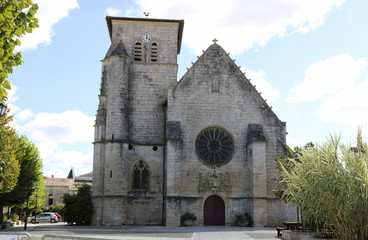 Fototapeta na wymiar The Collegiate Church Sante-Catherine in Magné Western France. . Gothic style church, the 16th.