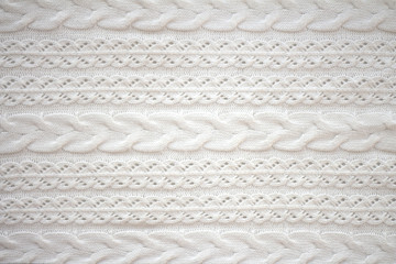 Texture of a knitted white sweater