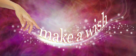Go on and make a wish - female hand appearing to send out a whoosh of sparkles with the words MAKE...
