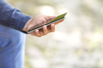 Hand man with tablet o cell