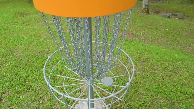 19410_Top_view_of_the_chains_and_the_orange_disc_golf.mov