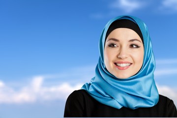 Young arabian woman on light background