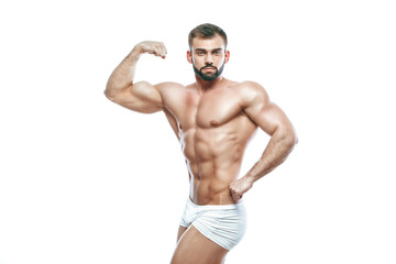 Fototapeta na wymiar bodybuilder posing. Beautiful sporty guy male power. Fitness muscled manin white lingerie. on isolated white background.