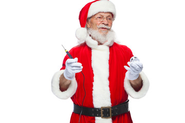Fototapeta na wymiar Christmas. Santa Claus in white gloves holding a soldering iron with a solder. Electronics, equipment repair. Ad of a master on equipment repair. Isolated on white background