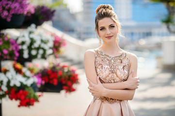 Beautiful girl in wedding dress outdoor. Happy girl in prom.