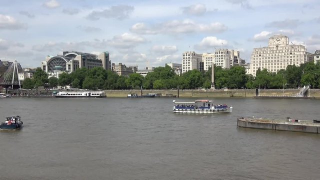 Panoramic view of cityscape and Thames river with running boats in city London.