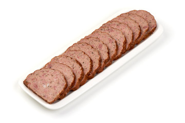 Traditional baked meatloaf slices on the white plate, isolated on white background.