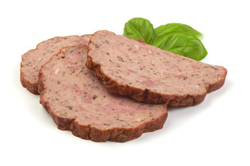 Traditional baked meatloaf slices with basil leaves, isolated on white background.