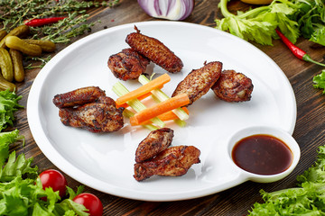 grilled chicken wings and vegetables