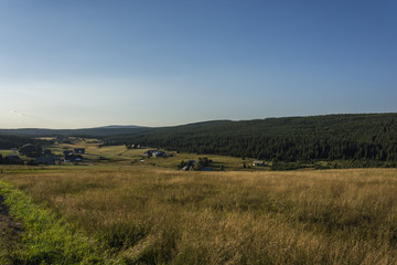 Evening view on the mountain landscape with the dominant hill. The area 