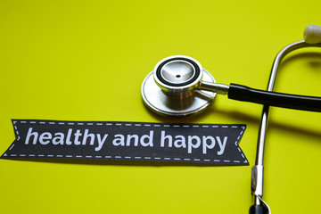 Closeup Healthy and happy with stethoscope concept inspiration on yellow background