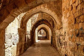 Velvet curtains Historic building Sreet of Jerusalem Old City Alley made with hand curved stones. Israel