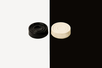  Black and white chips on black and white background.