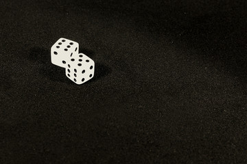 Dice. White cubes with black dots.