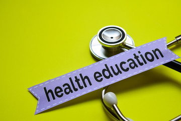 Closeup health education with stethoscope concept inspiration on yellow background
