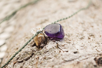Tiny fashionable female bracelet on wooden background