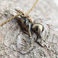 Tiny fashionable female bracelet on wooden background