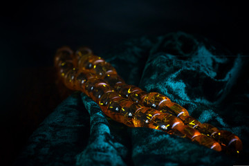 Ramadan Karim greeting background Islamic prayer amber bead (rosary). Ramadan Kareem beautiful poster, banner, postcard for the celebration of the festival of the Muslim community