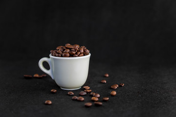 White Coffee Cup Filled with Coffee Beans