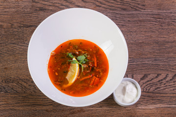 Solyanka soup with lemon