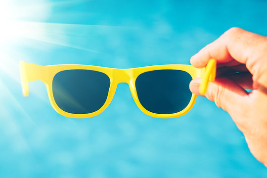 New sunglasses on a tropical beach