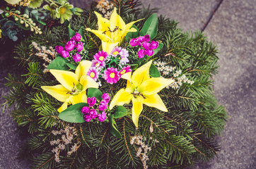 flowers decoration on grave at cemetery