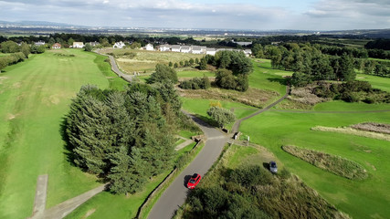 Aerial view over the village of Bridge of Weir and surrounding countryside.