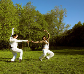 two girl jumping in park