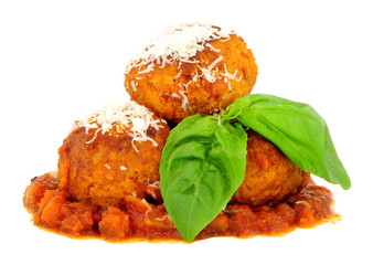 Large pork meatballs with tomato sauce isolated on a white background