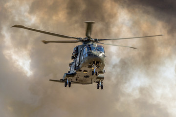 Fototapeta na wymiar Helicopter in smoke