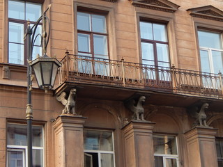 Sculptures of griffins as an ornament of the facade of an ancient building in St. Petersburg, Russia