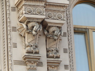 Sculptures of griffins as an ornament of the facade of an ancient building in St. Petersburg, Russia