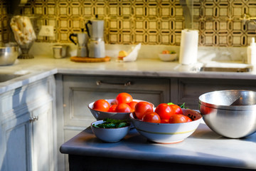 Tomatoes in a bowl on a counter in an Italian kitchen in Florence, Italy