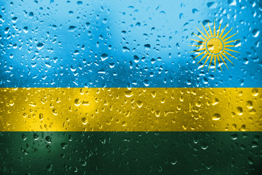 Texture Of Rwanda   Flag On The Glass With Drops Of Rain.