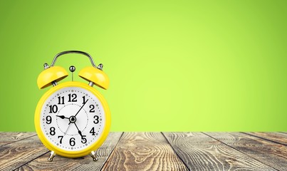 Retro alarm clock on table  background