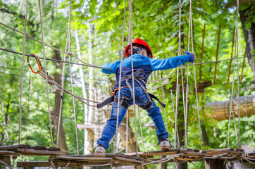 boy the child crosses the cable car
