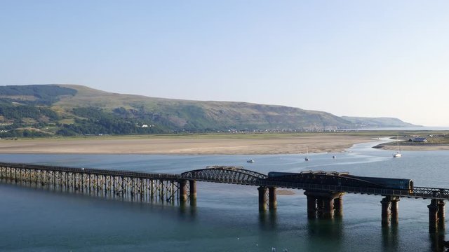 The rail and footbridge over the Mawddach estuary Barmouth Gwynedd North Wales