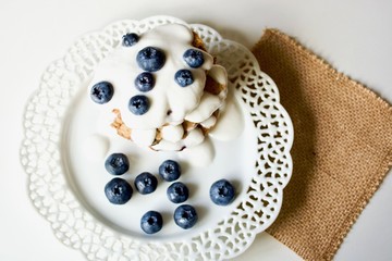 Tasty blueberry pancakes with coconut dipping.