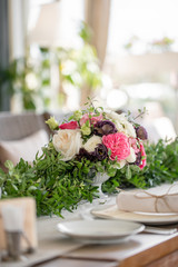 Wedding Banquet or gala dinner. The chairs and table for guests, served with cutlery and crockery. Covered with a linen tablecloth runner. party on terrace